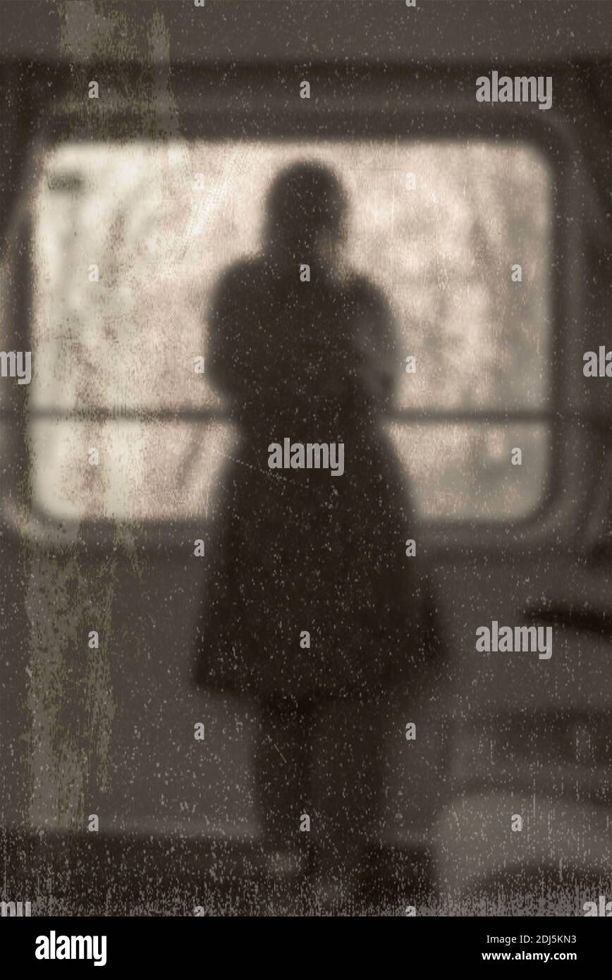 Blurred old vintage picture of a lonely girl in a train looking through the window. Stock Photo