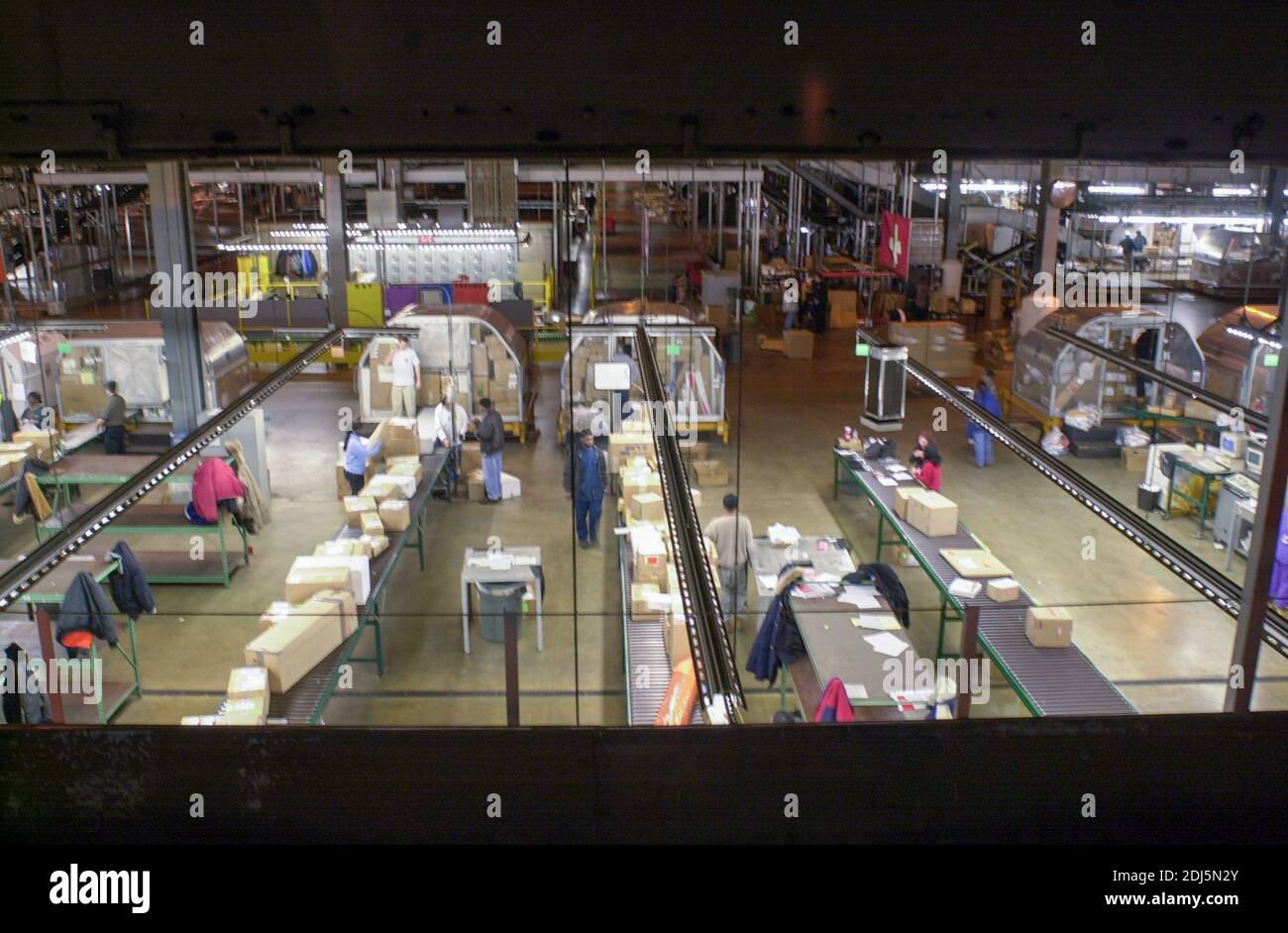 United Parcel Servce employees sort through packages to be shipped throughout the world Thursday, December 14, 2000 at Philadelphia International Airp Stock Photo