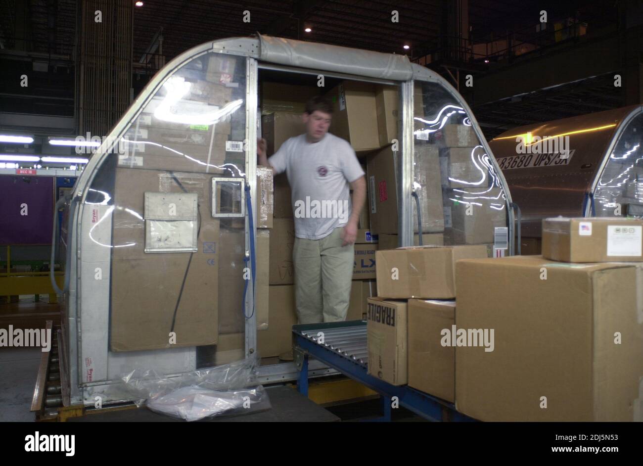 United Parcel Servce employees sort through packages to be shipped throughout the world Thursday, December 14, 2000 at Philadelphia International Airp Stock Photo