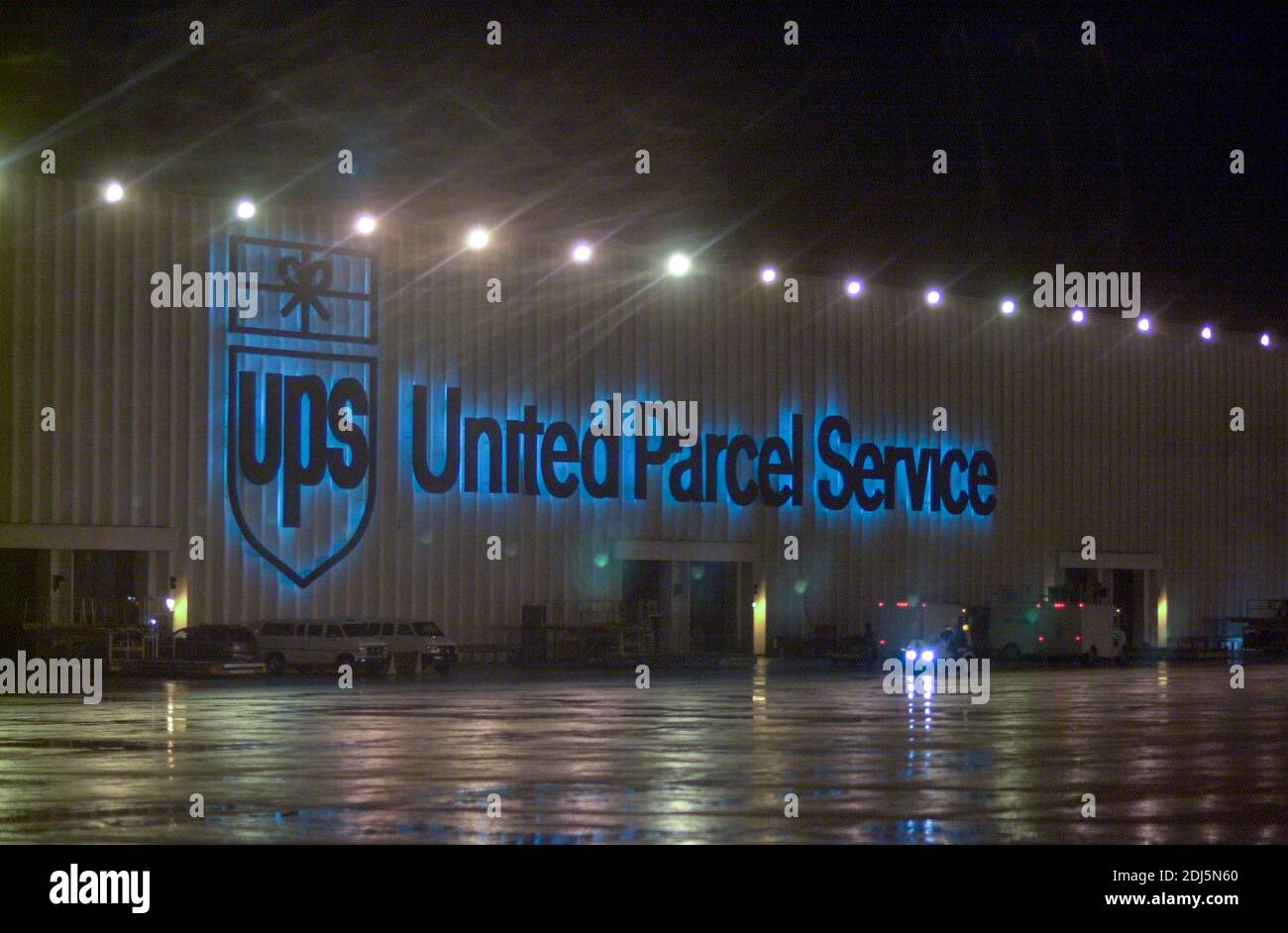 United Parcel Servce employees sort through packages to be shipped throughout the world Thursday, December 14, 2000 at Philadelphia International Airp Stock Photo