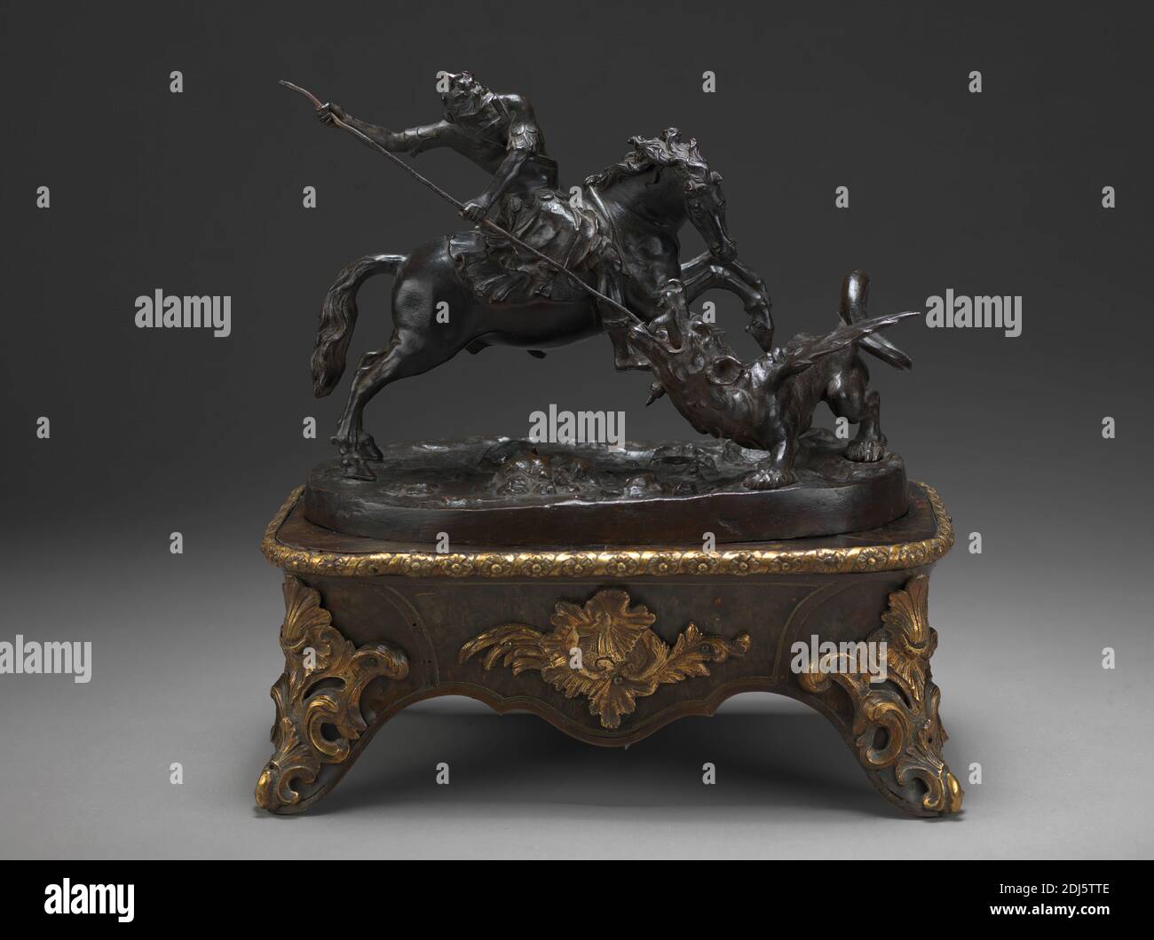 St. George and the Dragon, Francesco Fanelli, born 1577, Italian, active in Britain (from ca. 1632), ca. 1635, Bronze, on a later wooden base with tortoiseshell veneer and gilt bronze mounts, Overall: 11 1/2 × 11 1/2 × 8 inches (29.2 × 29.2 × 20.3 cm), dragon, religious and mythological subject, spear, St. George and the dragon Stock Photo