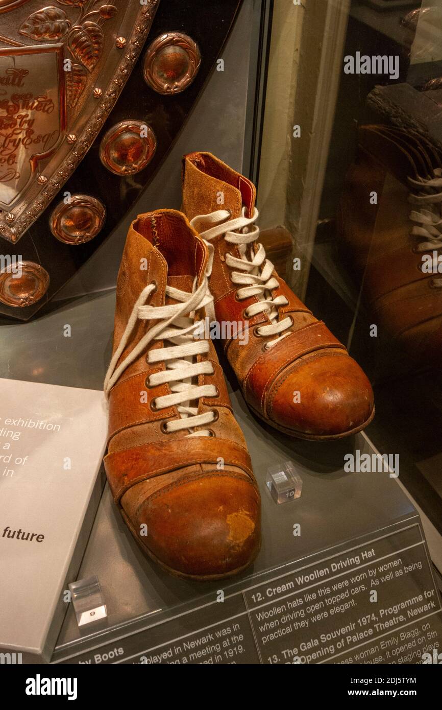 Vintage rugby boots on display in the National Civil War Centre, Newark Museum, Newark-on-Trent, Notts, UK. Stock Photo