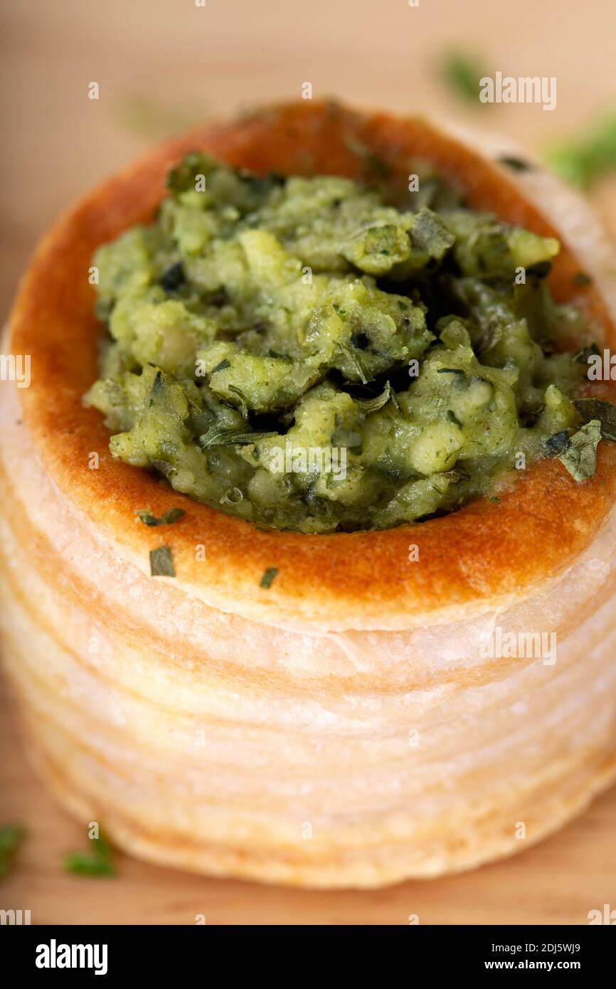 Puff pastry roll filled with pesto - close up view Stock Photo
