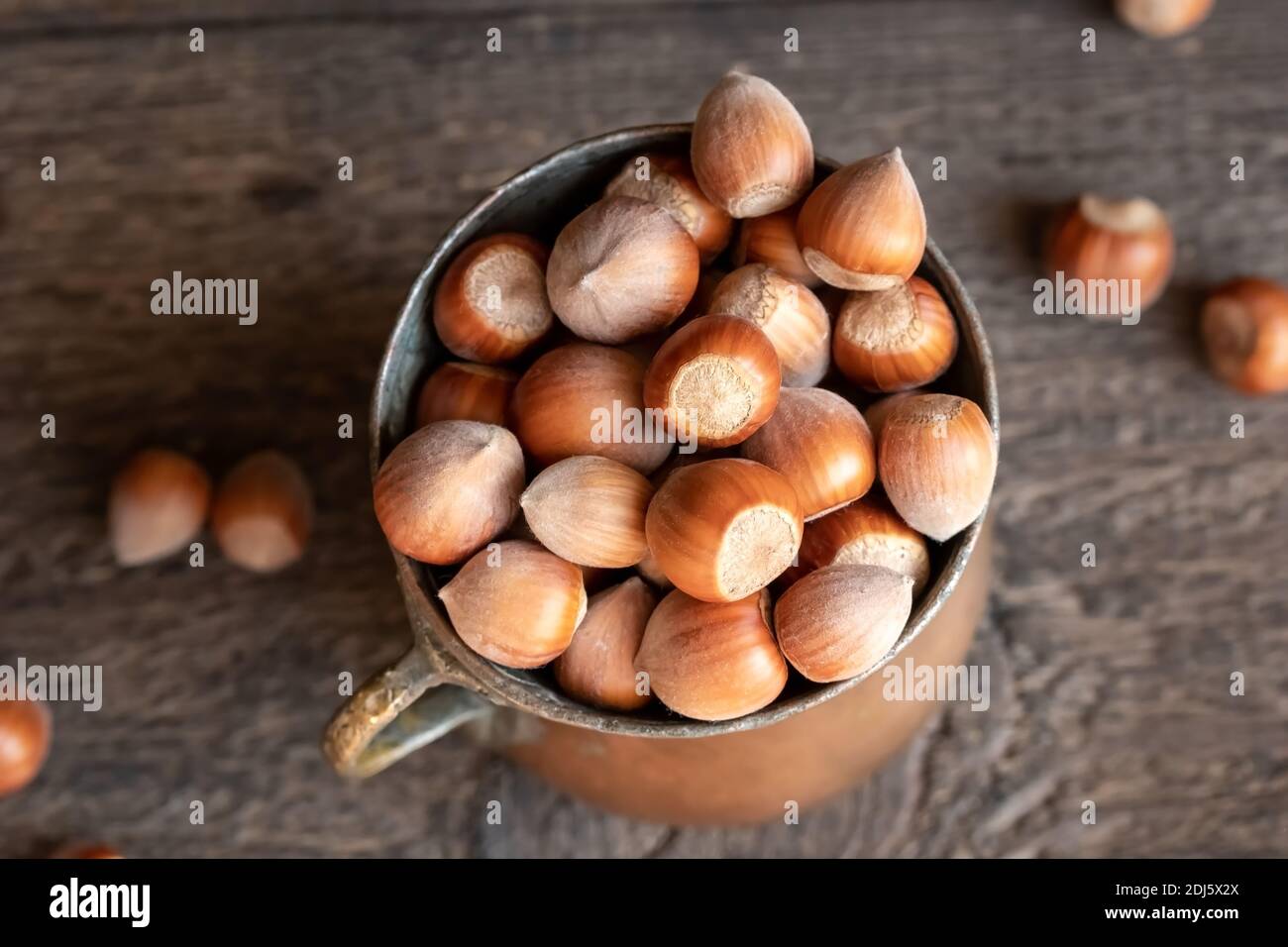 Hazelnuts in a vintage cup, top view Stock Photo Alamy