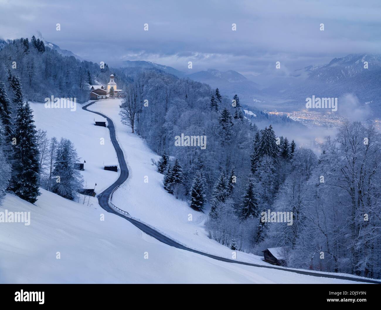 Winter Landscape - church village in the mountains Stock Photo