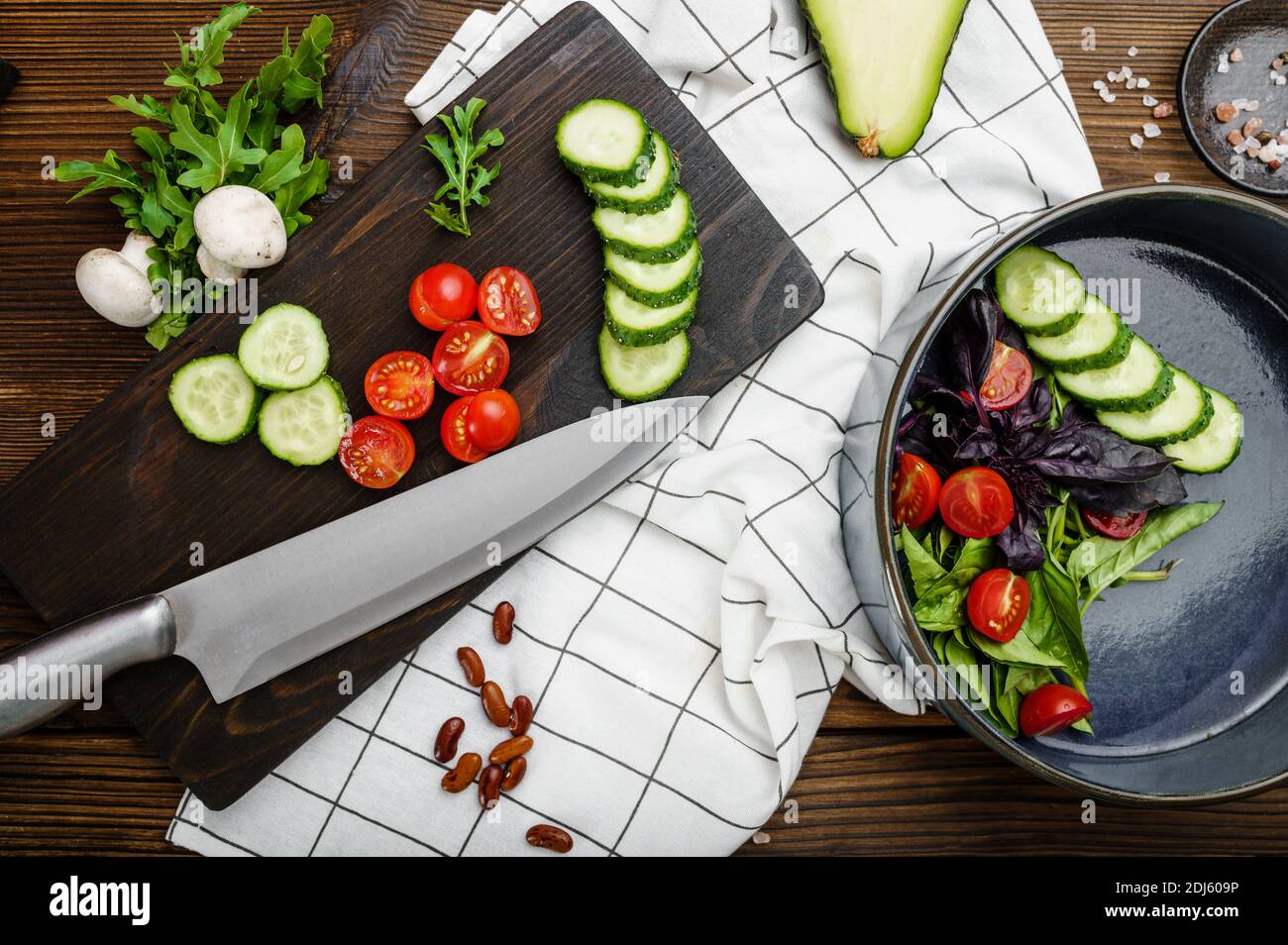Fresh cutted vegetables, wooden background Stock Photo