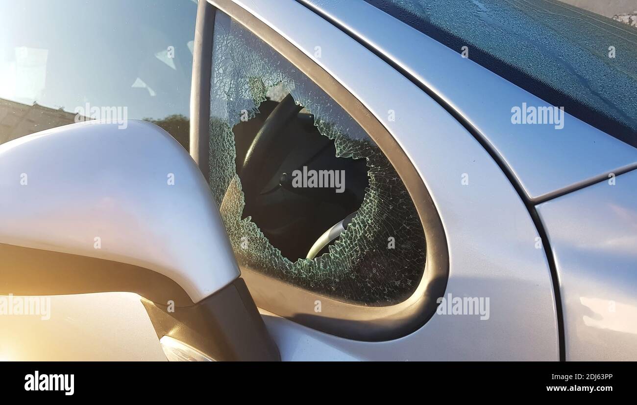 The burglar broke the side window of the car to steal. An example for