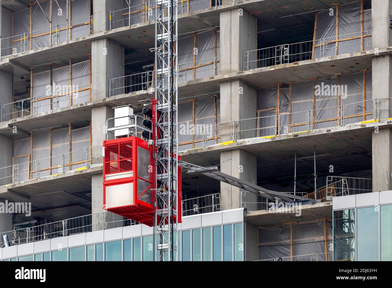 Construction hoists lift elevator for workers and material at the