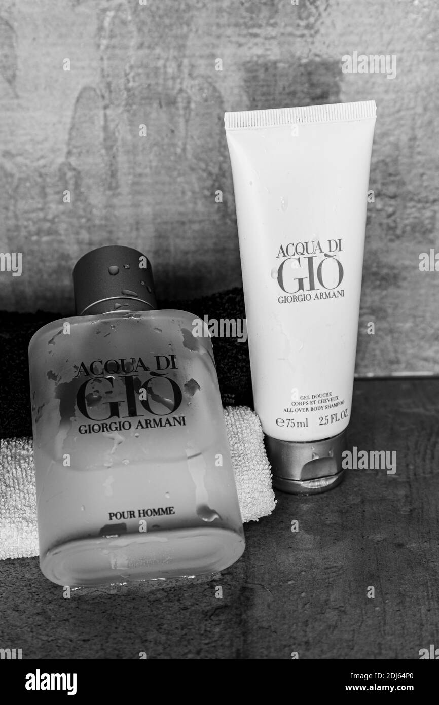 The luxury Acqua di Gio eau de toilette and shower gel from Armani for men  with water drops. Used for good hygiene and appearance Stock Photo - Alamy