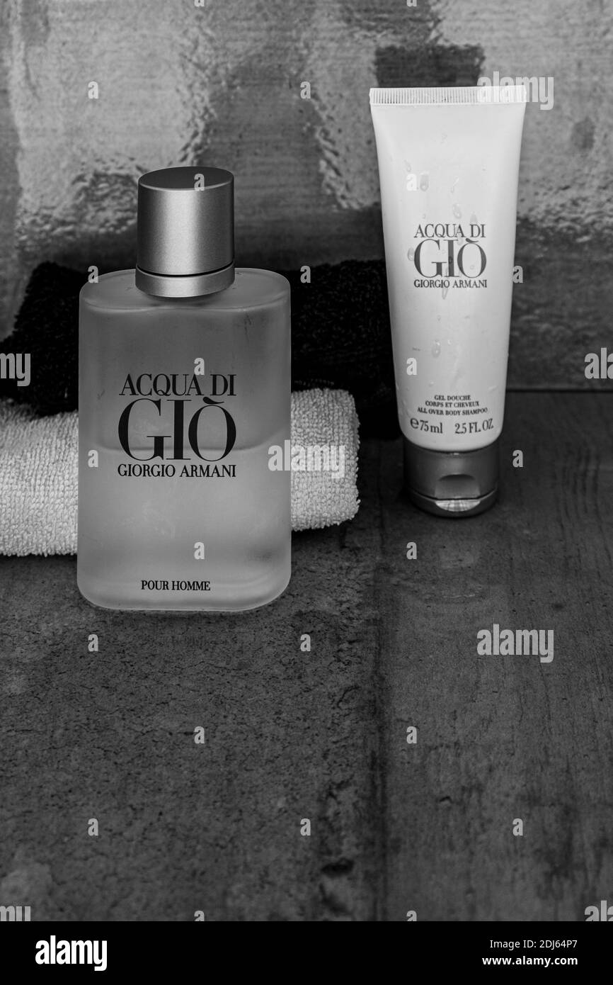The luxury Acqua di Gio eau de toilette and shower gel from Armani for men  with water drops. Used for good hygiene and appearance Stock Photo - Alamy