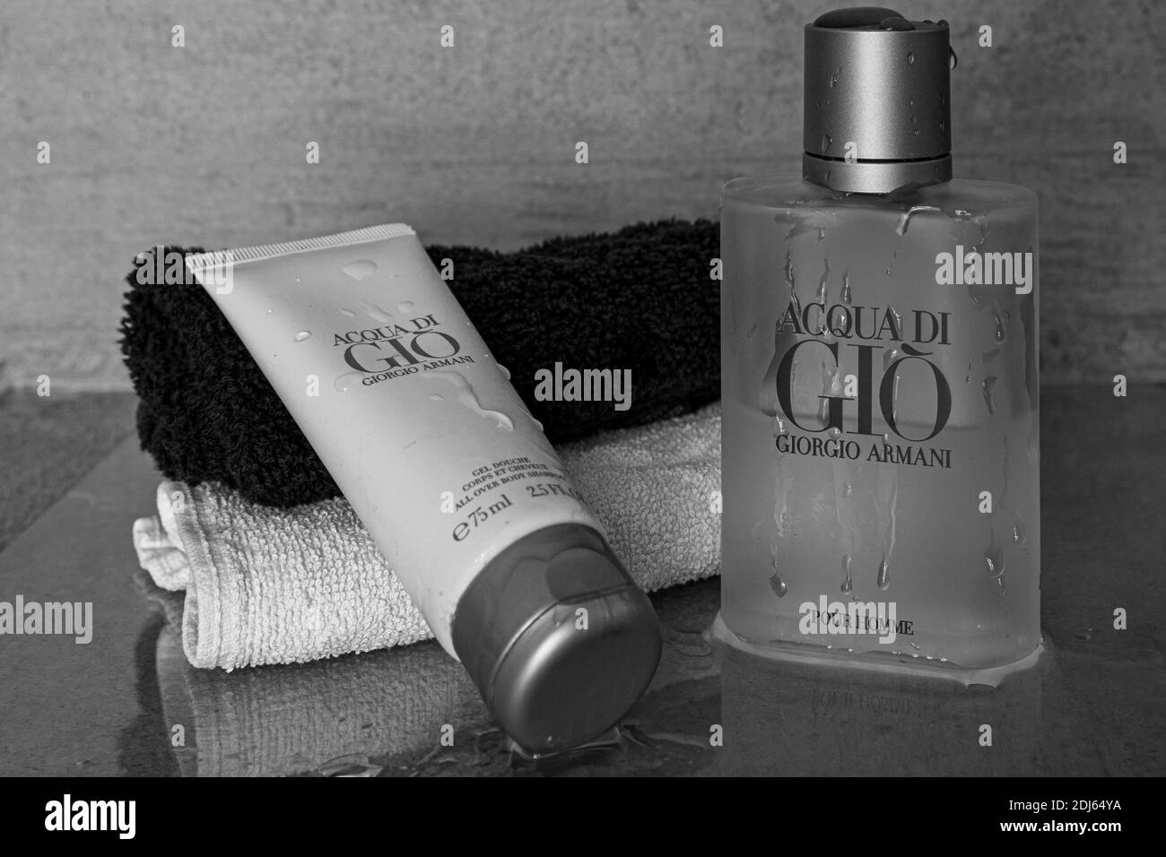 The luxury Acqua di Gio eau de toilette and shower gel from Armani for men with water drops. Used for good hygiene and appearance Stock Photo Alamy