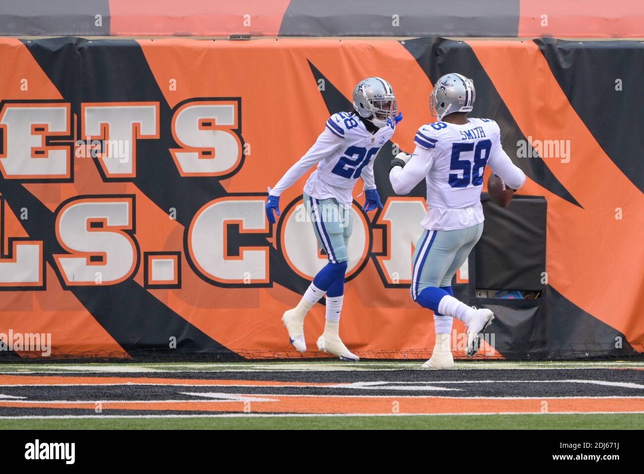 Cincinnati, OH, USA. 13th Dec, 2020. Cincinnati Bengals strong safety Vonn  Bell #24 tackles Dallas Cowboys running back Ezekiel Elliott #21 during NFL  football game action between the Dallas Cowboys and the