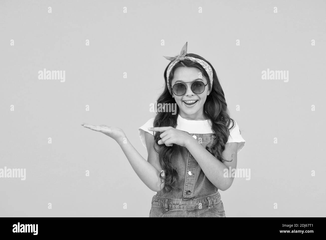 Fancy girl pointing copy space, seasonal sale concept Stock Photo - Alamy