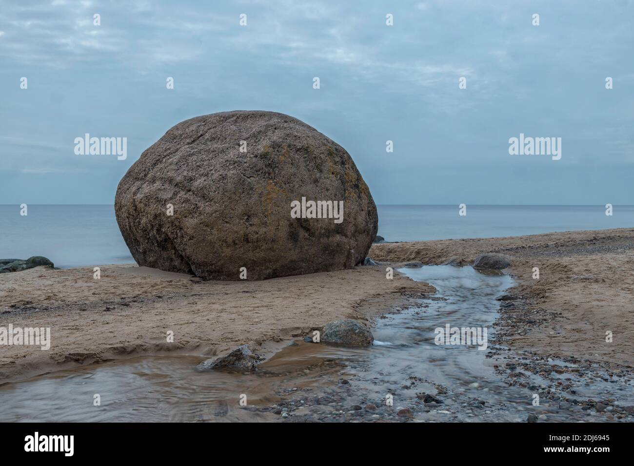 Stone Laucu Akmens located on the Rigas Bay beach in Latvia long exposure Stock Photo