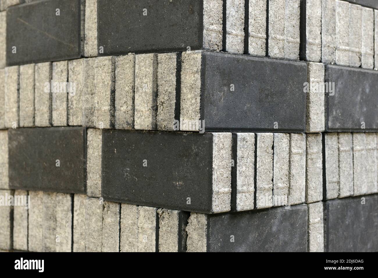 A pile of paving bricks awaits laying on a street in eastern Beijing, China Stock Photo