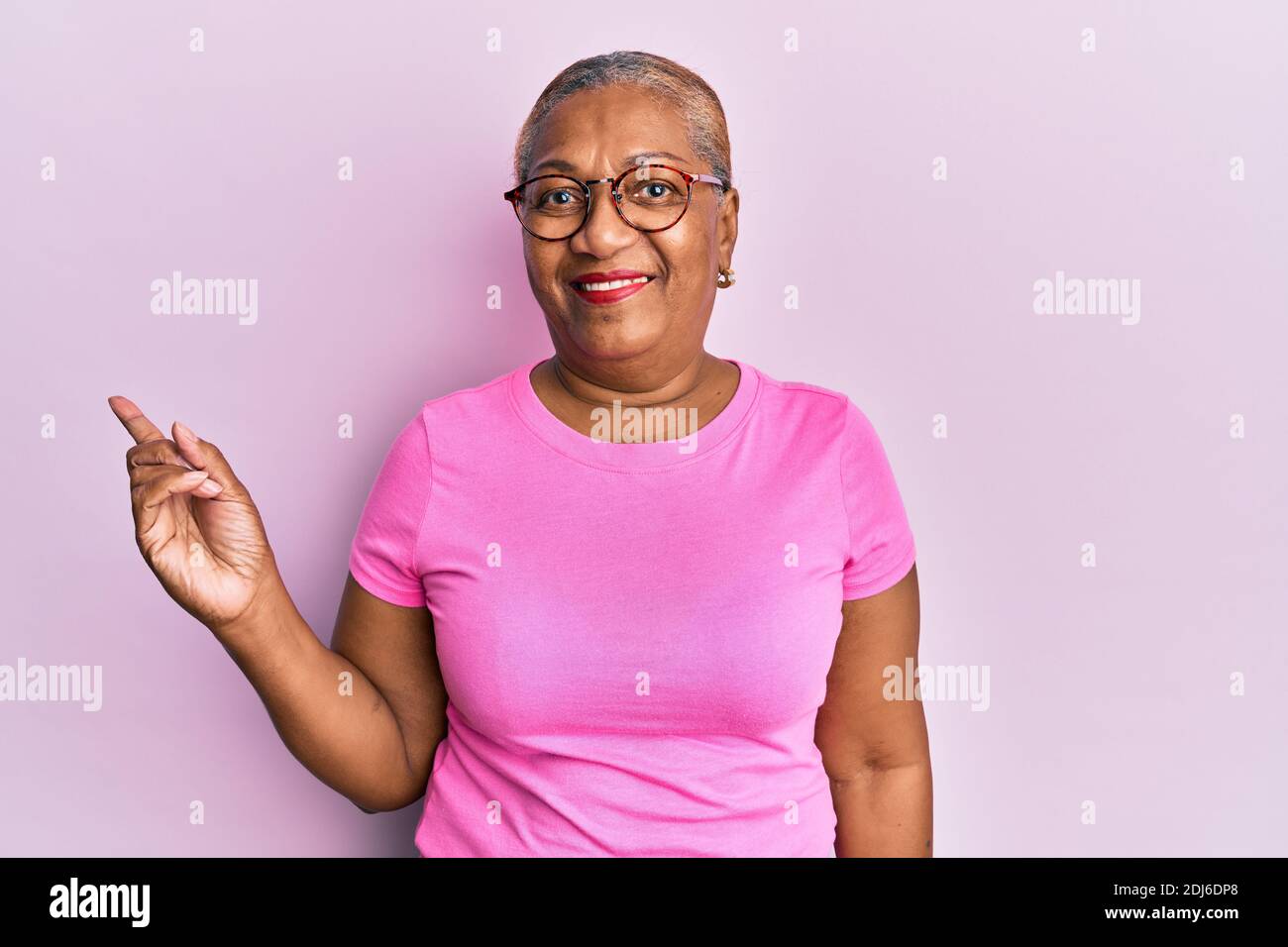 Senior african american woman wearing casual clothes and glasses ...