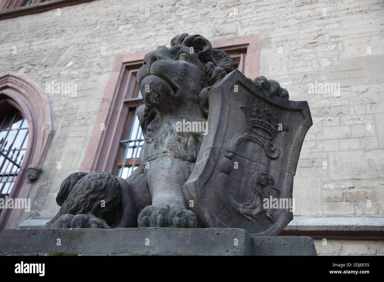 Heraldic lion stone statue landmark. Wappenlowe Gottingen Germany. Side view. Stock Photo