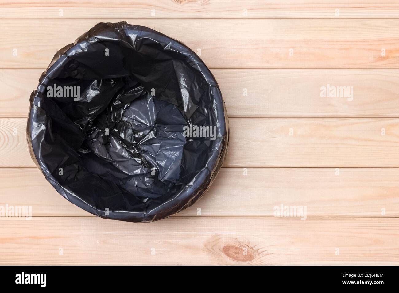Empty Bin on Wooden Background. Trash Can Top View. Garbage Basket