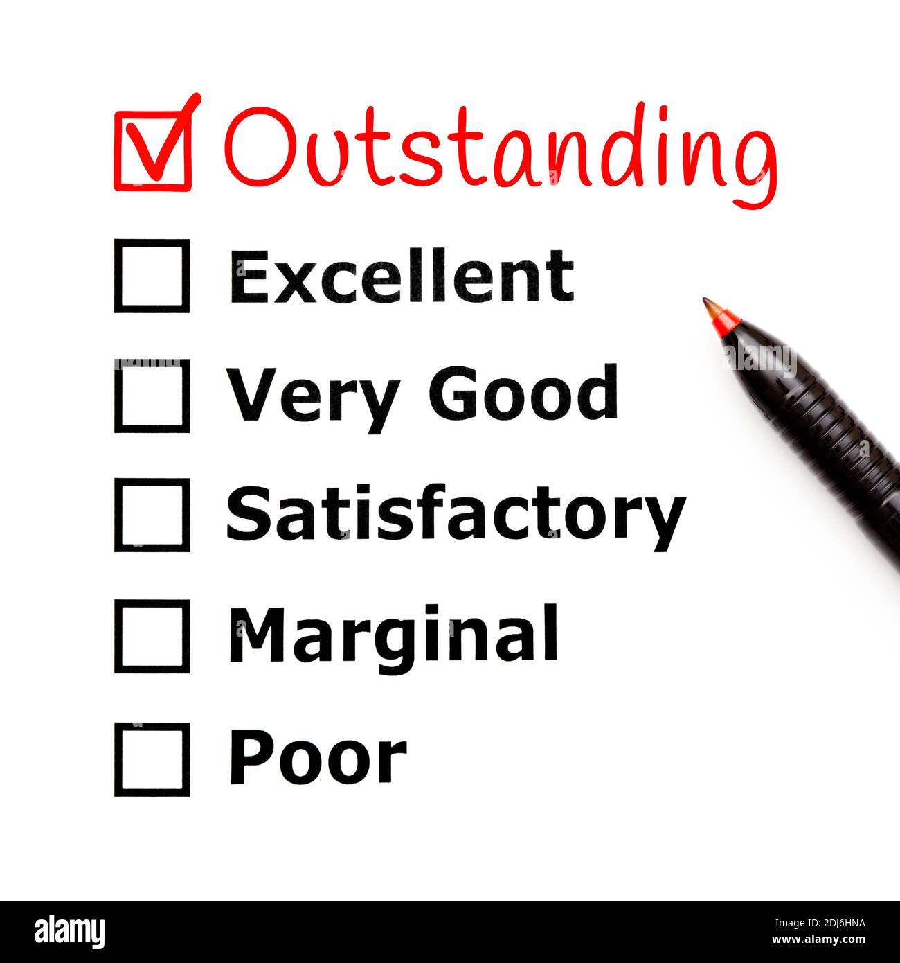 Handwritten Outstanding with red pen on customer service evaluation form checklist added above excellent. Stock Photo
