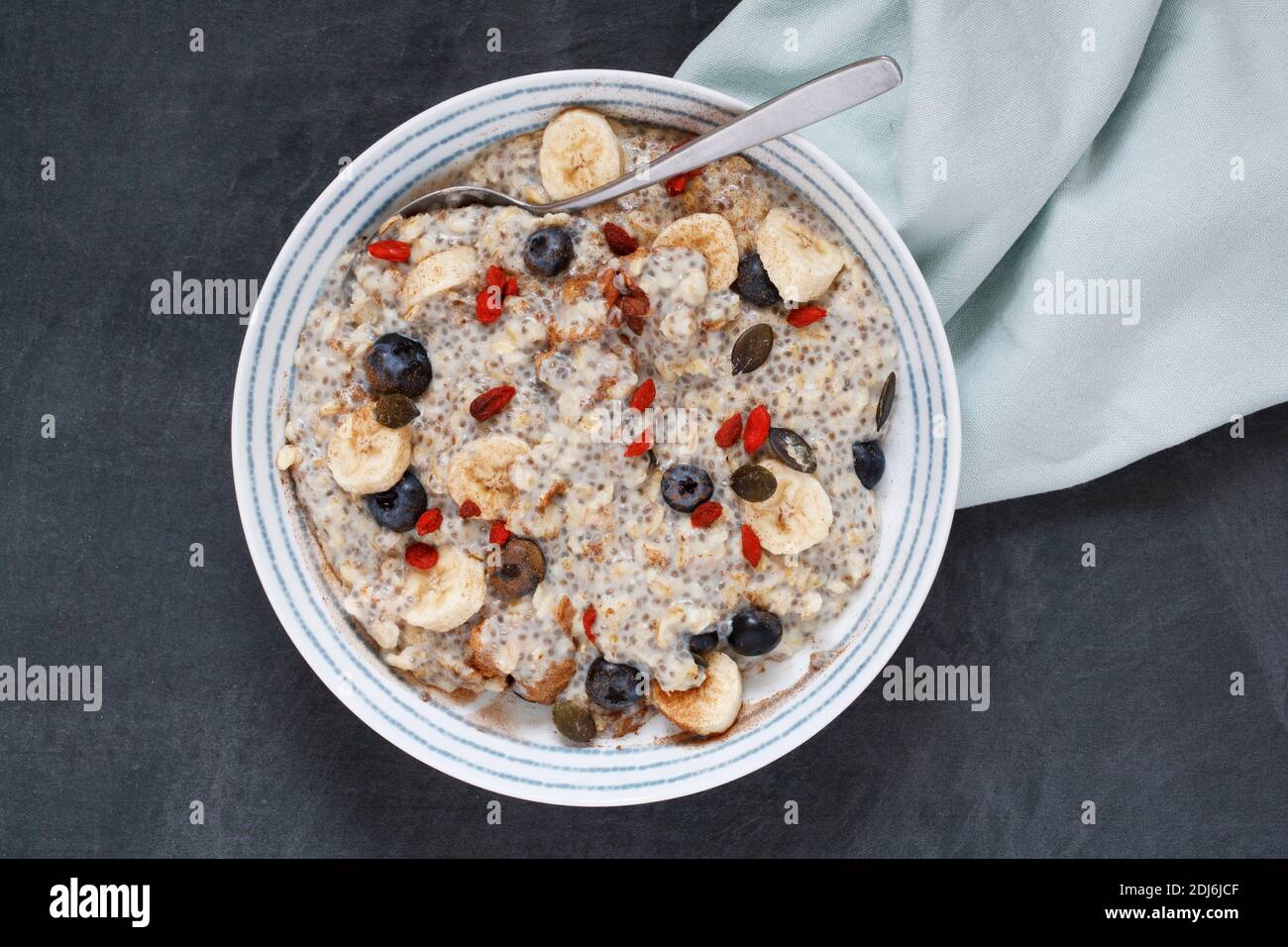 A healthy breakfast. Oat and Chia porridge with fruits and seeds. Stock Photo