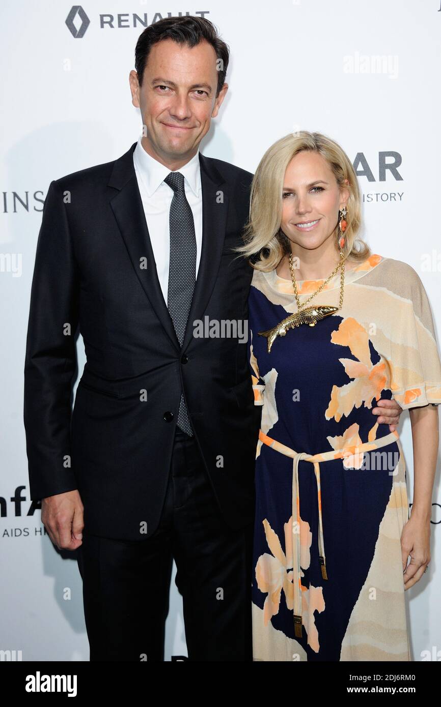 Stylist Tory Burch and Chief Executive of LVMH Fashion Group Pierre-Yves  Roussel attending the Amfar dinner as part of Paris Fashion Week at the  Peninsula Hotel in Paris, France on July 03