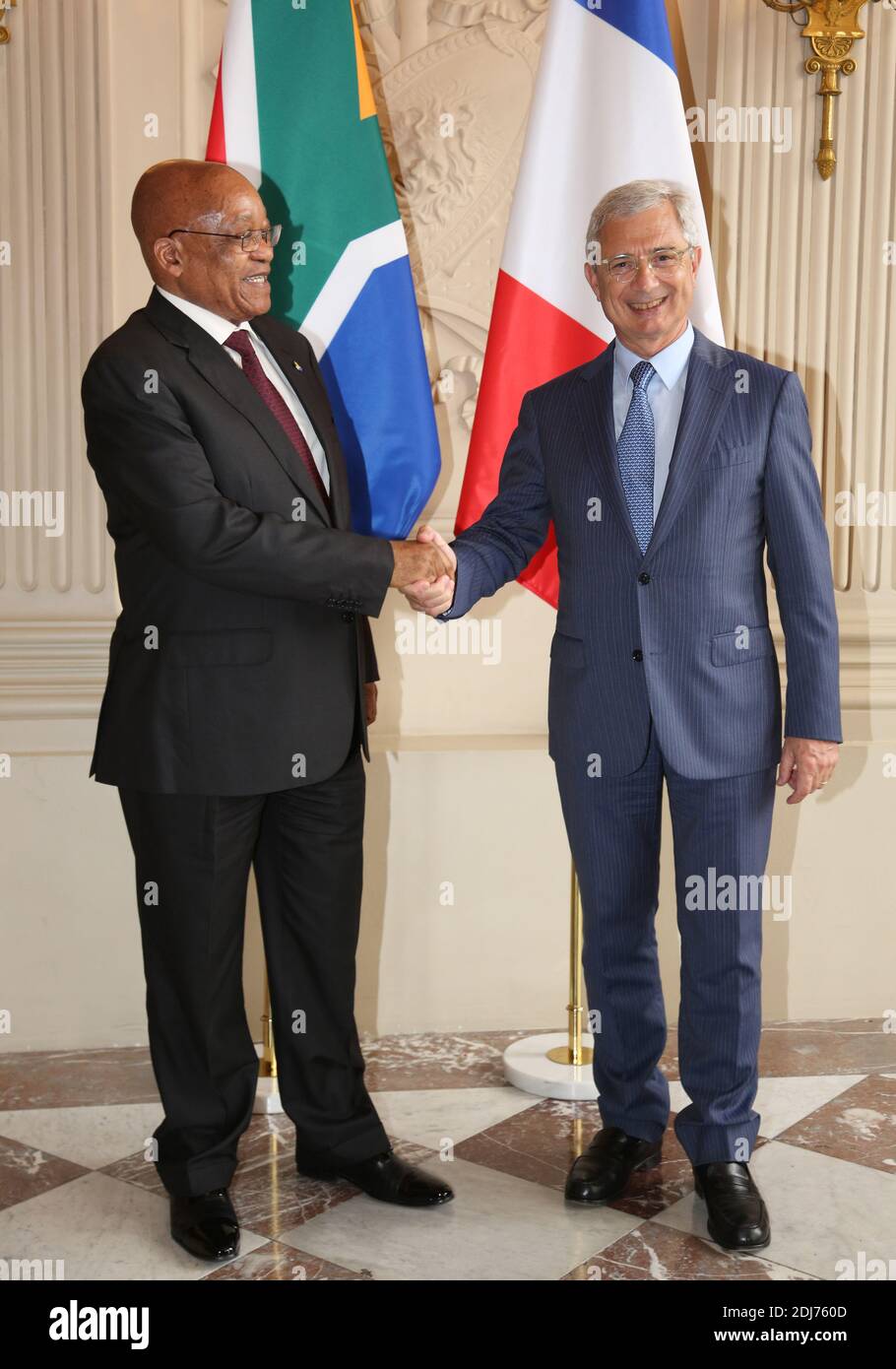 South African President Jacob Zuma shakes hand with Claude Bartolone