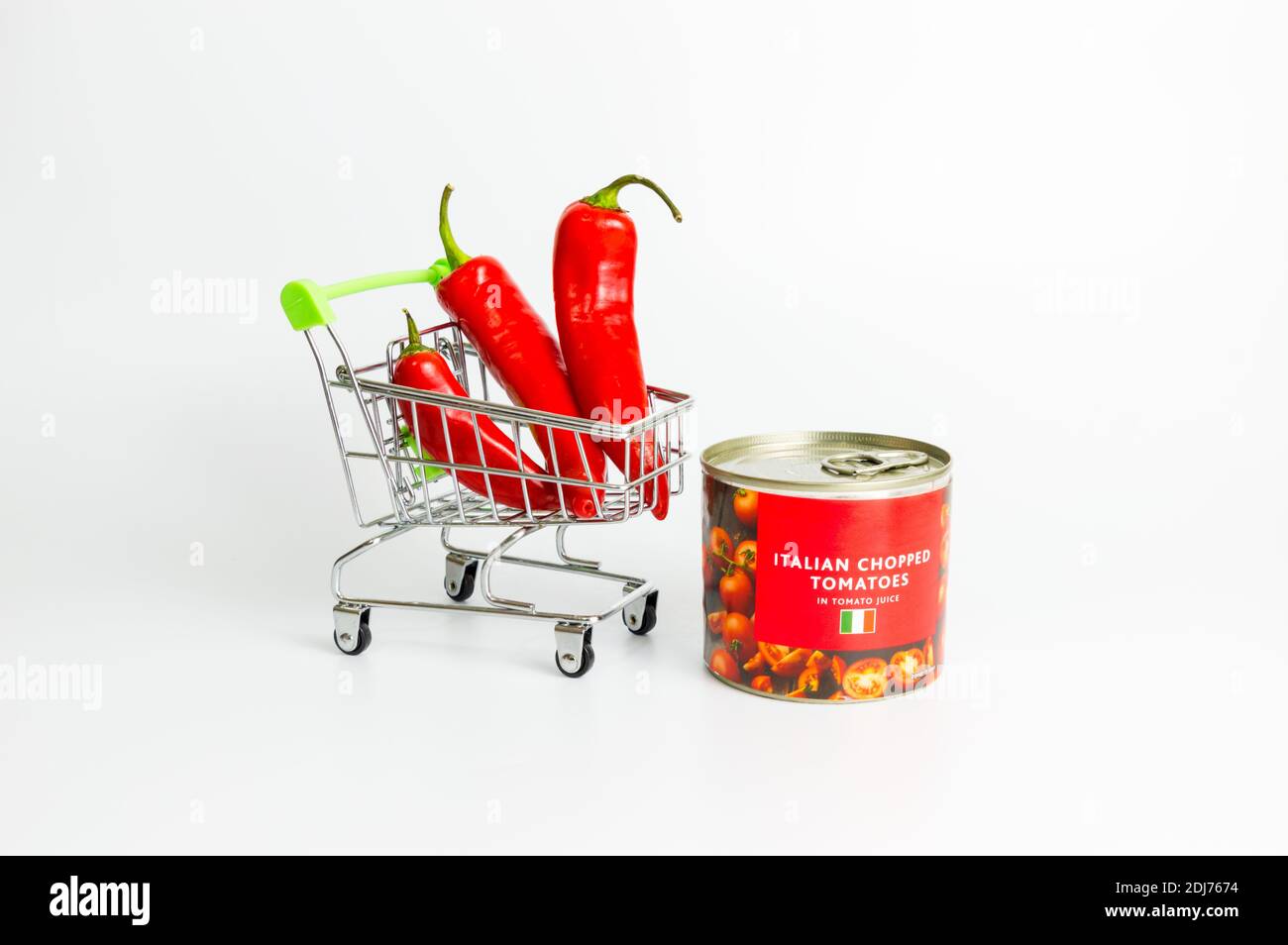 Red chilli and canned tomatoes on white background Stock Photo Alamy