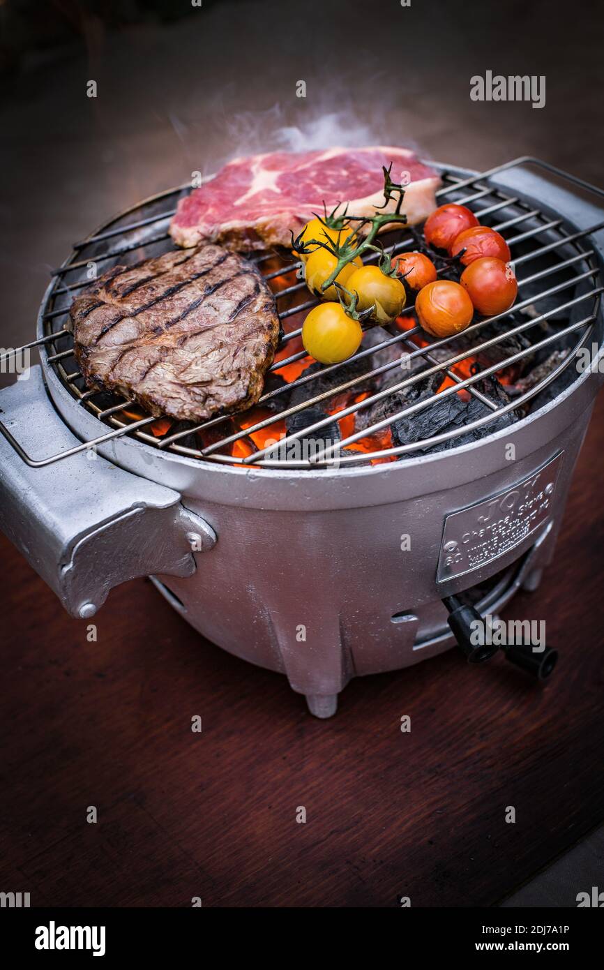 Barbecue steak cooking on a flame bbq grill Stock Photo