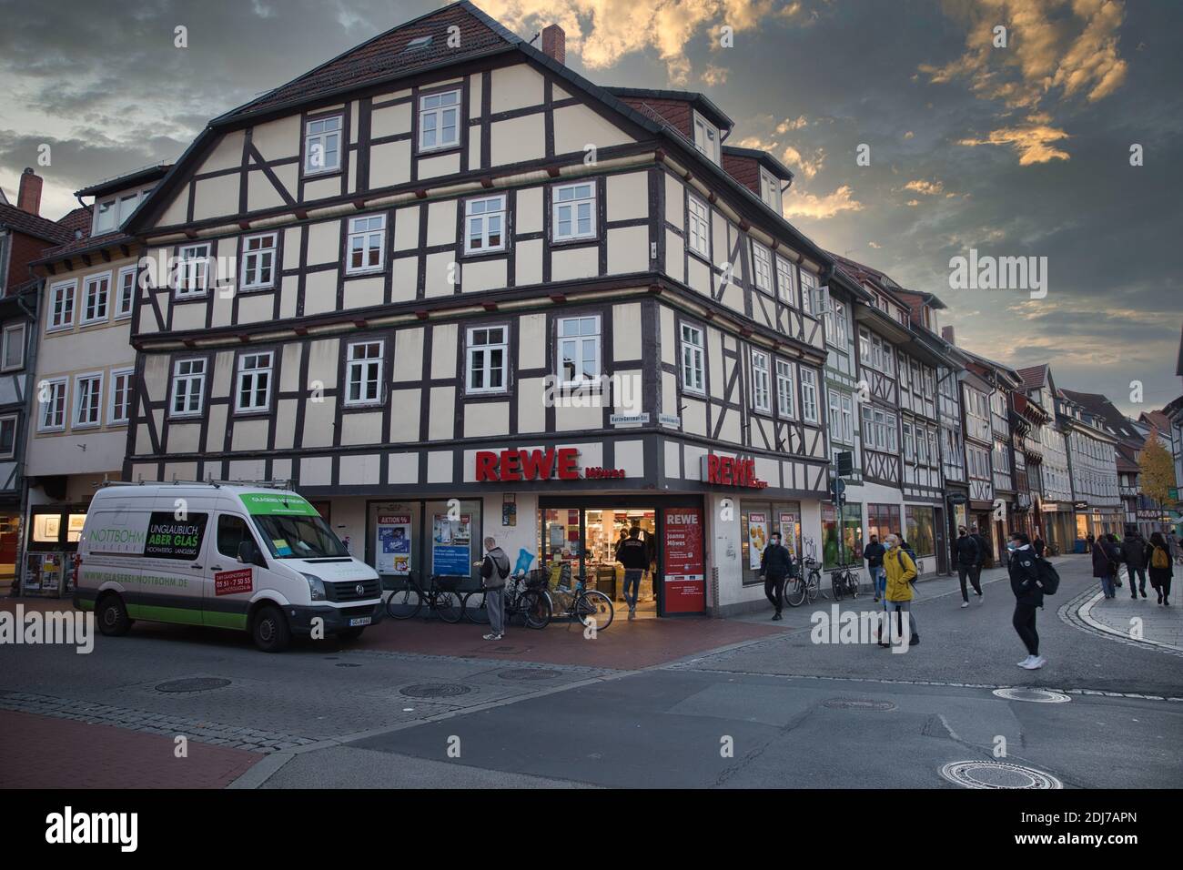 Göttingen Germany. Autumn, 2020. Grocery store in old town Goettingen with people on street. Stock Photo