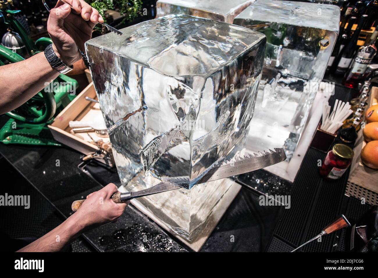 bartender sawing ice Stock Photo Alamy