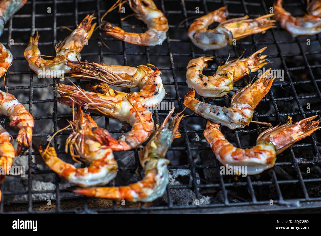 Grilled king size Prawns on grill BBQ Stock Photo