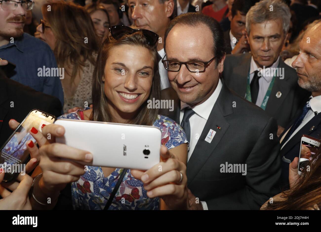 French President Francois Hollande poses for selfies as he visits the Club France, on August 5, 2016 before the start of the Rio 2016 Olympic Games in Rio de Janeiro. The carnival capital of Rio de Janeiro will host a glittering Olympics opening ceremony party on Friday, hoping to draw a line under a turbulent seven-year build-up dogged by recession, drugs scandals, crime and infrastructure stumbles. Photo by Jack Guez/Pool/ABACAPRESS.COM Stock Photo