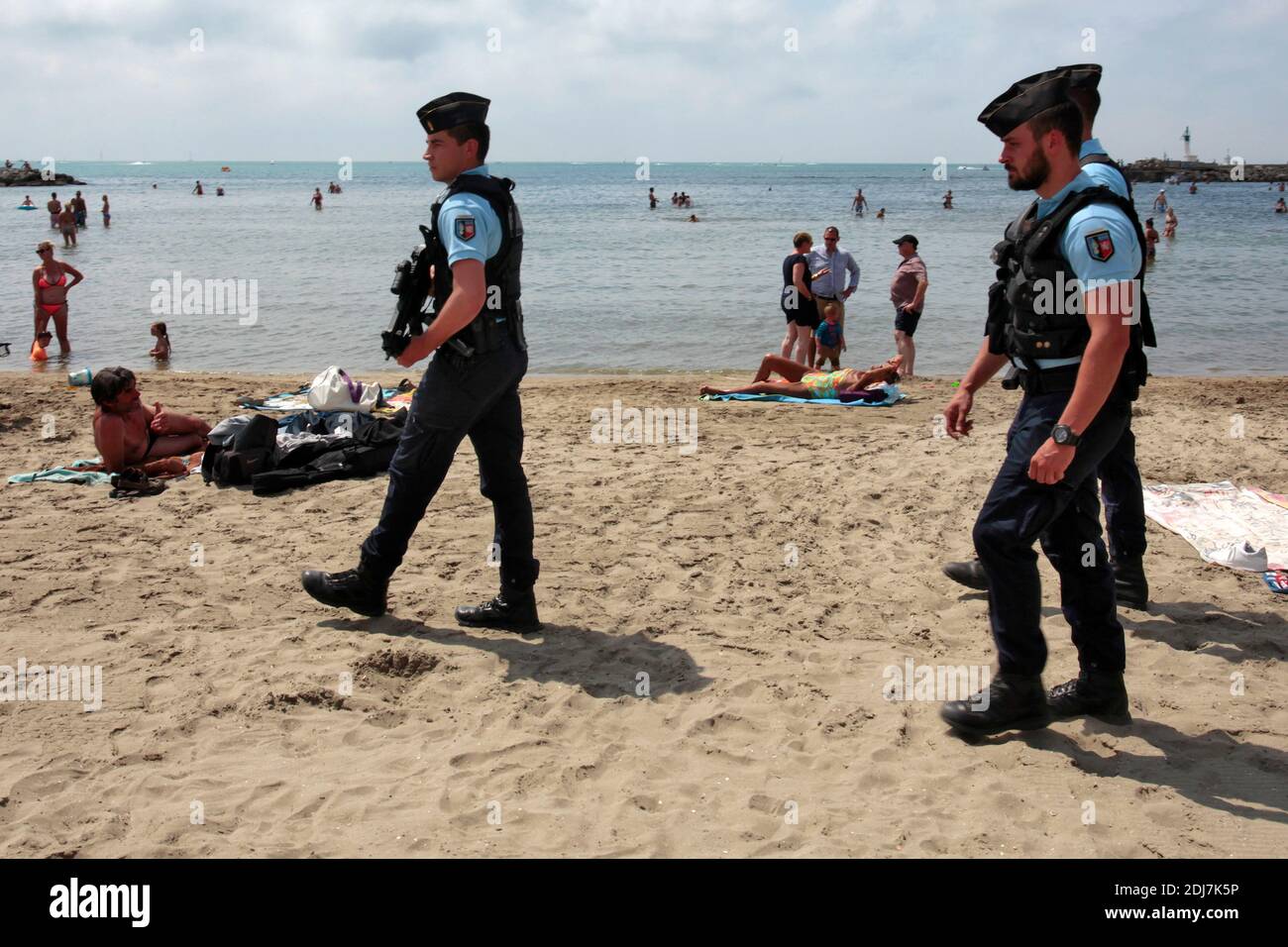 Armed national and municipal police forces as well as military officers ...