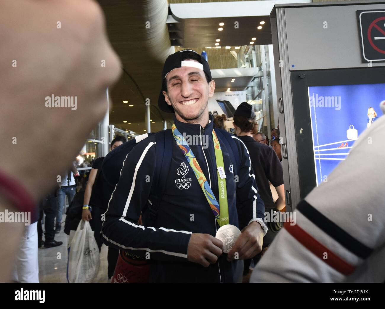 French Boxer And Silver Medallist Sofiane Oumiha Shows His Medal As He french-boxer-and-silver-medallist-sofiane-oumiha-shows-his-medal-as-he