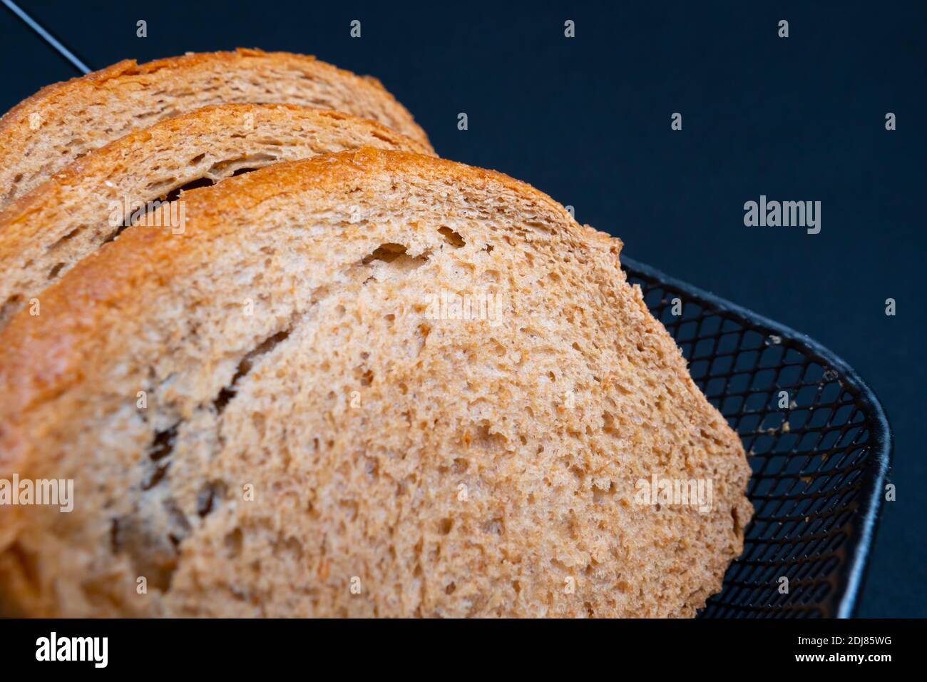 Whole grain bread on black background Stock Photo