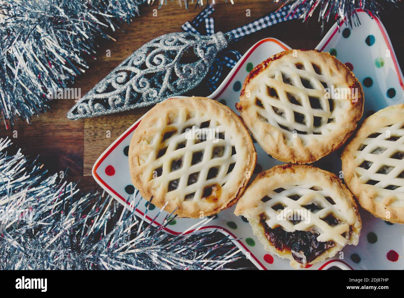 Christmas platter of fruit mince pies with festive decoration Stock