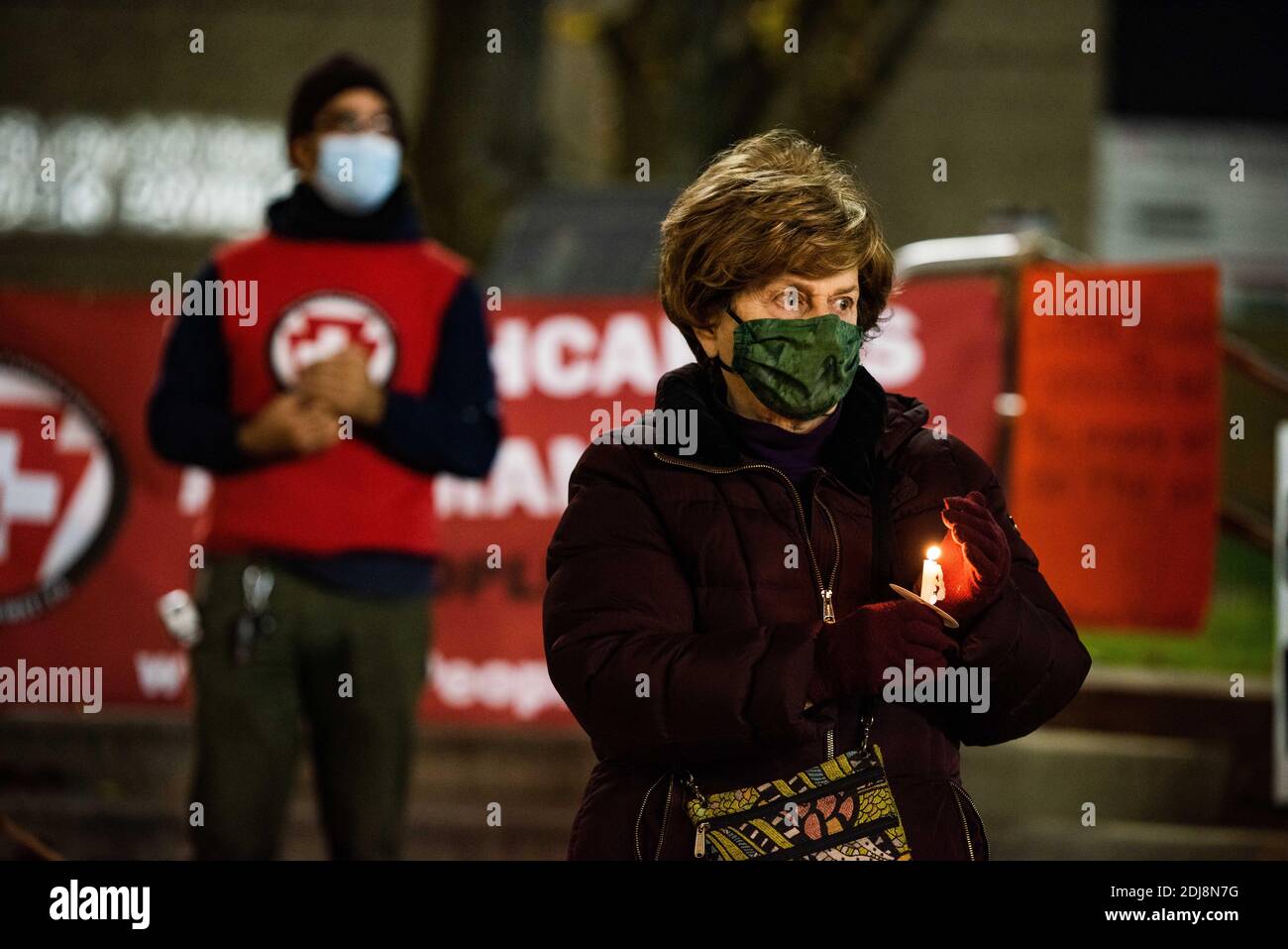 Philadelphia, Pennsylvania, USA. 12th Dec, 2020. Members of the statewide campaign, Put People First-PA, the Nonviolent Medicaid Army and the National Union for the Homeless, gathered in front of Temple University's North Philadelphia hospital campus bringing attention to the extreme pressures healthcare facilities are facing as the Covid-19 pandemic rages across the US, killing over 3000 people a day. The groups claim the root of the crisis is a healthcare system that puts profits over people resulting in short staffing, longer shifts, and inadequate protections. Members also gathered onli Stock Photo