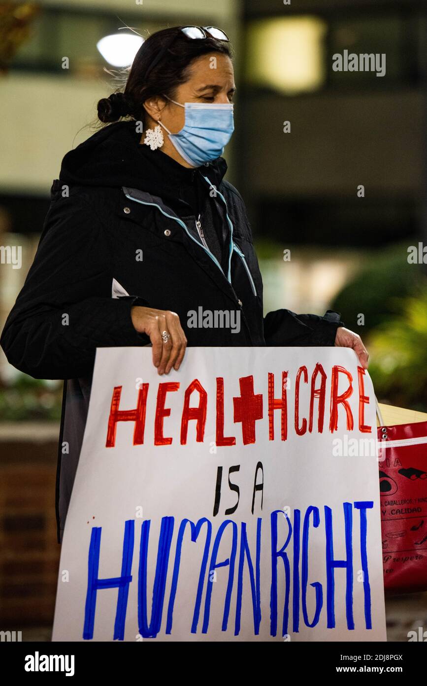 Philadelphia, Pennsylvania, USA. 12th Dec, 2020. Members of the statewide campaign, Put People First-PA, the Nonviolent Medicaid Army and the National Union for the Homeless, gathered in front of Temple University's North Philadelphia hospital campus bringing attention to the extreme pressures healthcare facilities are facing as the Covid-19 pandemic rages across the US, killing over 3000 people a day. The groups claim the root of the crisis is a healthcare system that puts profits over people resulting in short staffing, longer shifts, and inadequate protections. Members also gathered onli Stock Photo