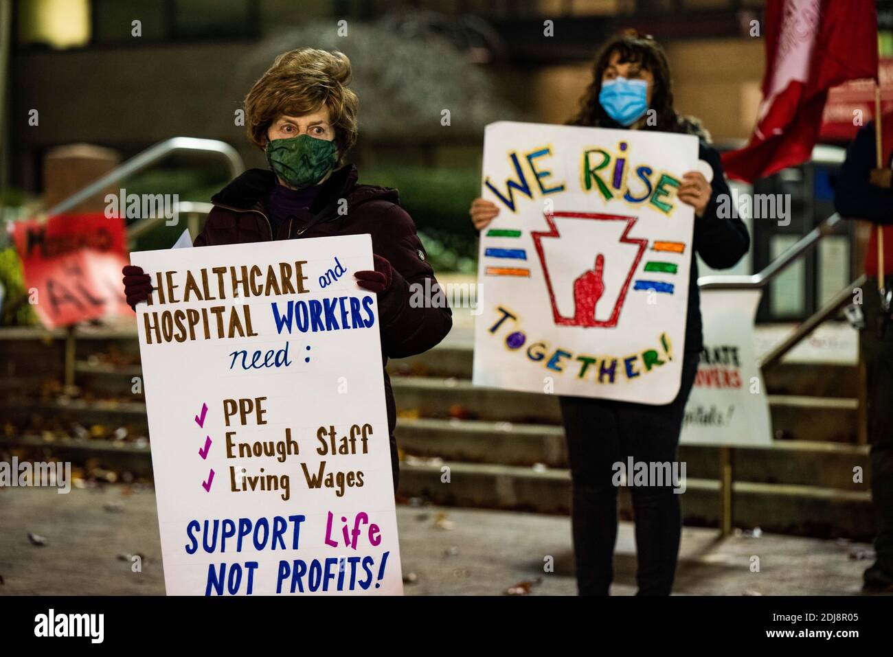 Philadelphia, Pennsylvania, USA. 12th Dec, 2020. Members of the statewide campaign, Put People First-PA, the Nonviolent Medicaid Army and the National Union for the Homeless, gathered in front of Temple University's North Philadelphia hospital campus bringing attention to the extreme pressures healthcare facilities are facing as the Covid-19 pandemic rages across the US, killing over 3000 people a day. The groups claim the root of the crisis is a healthcare system that puts profits over people resulting in short staffing, longer shifts, and inadequate protections. Members also gathered onli Stock Photo