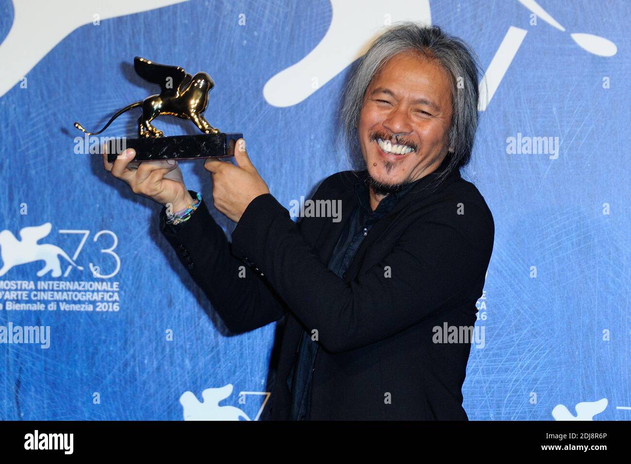 Director Lav Diaz poses with Golden Lion for Best Film for his movie 'The Woman who Left' during the Winners Photocall on the Lido in Venice, Italy as part of the 73rd Mostra, Venice International Film Festival on September 10, 2016. Photo by Aurore Marechal/ABACAPRESS.COM Stock Photo