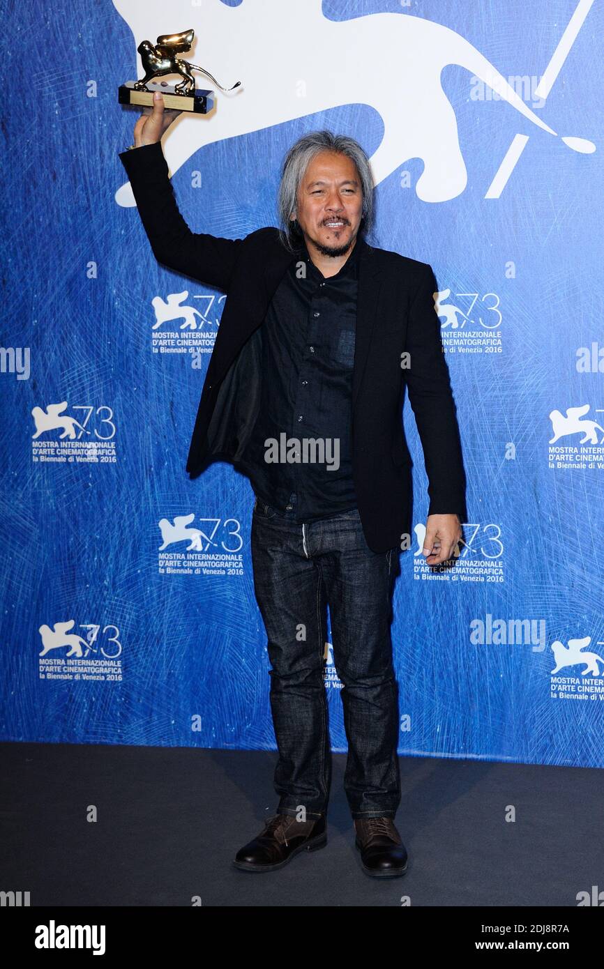 Director Lav Diaz poses with Golden Lion for Best Film for his movie 'The Woman who Left' during the Winners Photocall on the Lido in Venice, Italy as part of the 73rd Mostra, Venice International Film Festival on September 10, 2016. Photo by Aurore Marechal/ABACAPRESS.COM Stock Photo