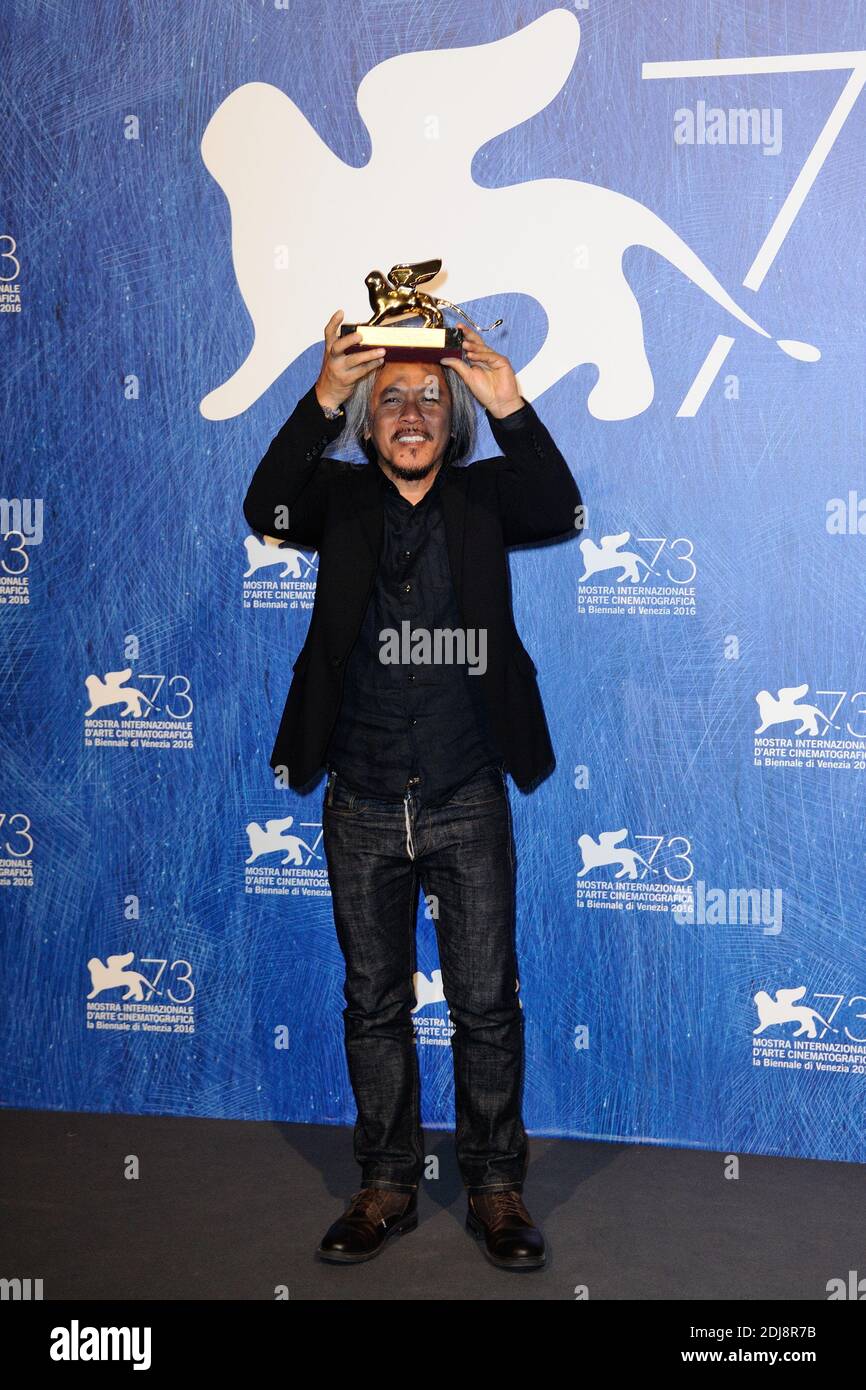 Director Lav Diaz poses with Golden Lion for Best Film for his movie 'The Woman who Left' during the Winners Photocall on the Lido in Venice, Italy as part of the 73rd Mostra, Venice International Film Festival on September 10, 2016. Photo by Aurore Marechal/ABACAPRESS.COM Stock Photo