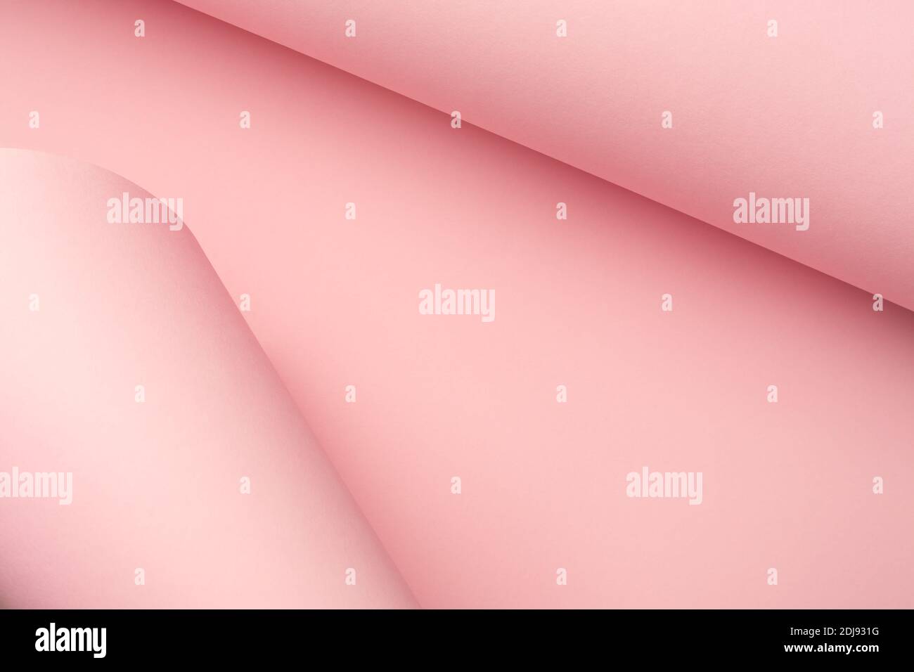 Pastel pink curved paper abstract background. Creative frame, copy space. Stock Photo
