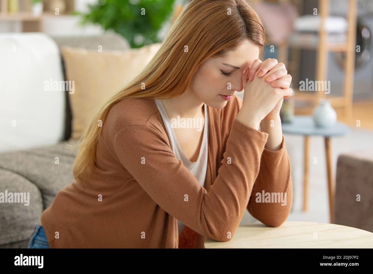 lonely woman suffering from depression at home Stock Photo