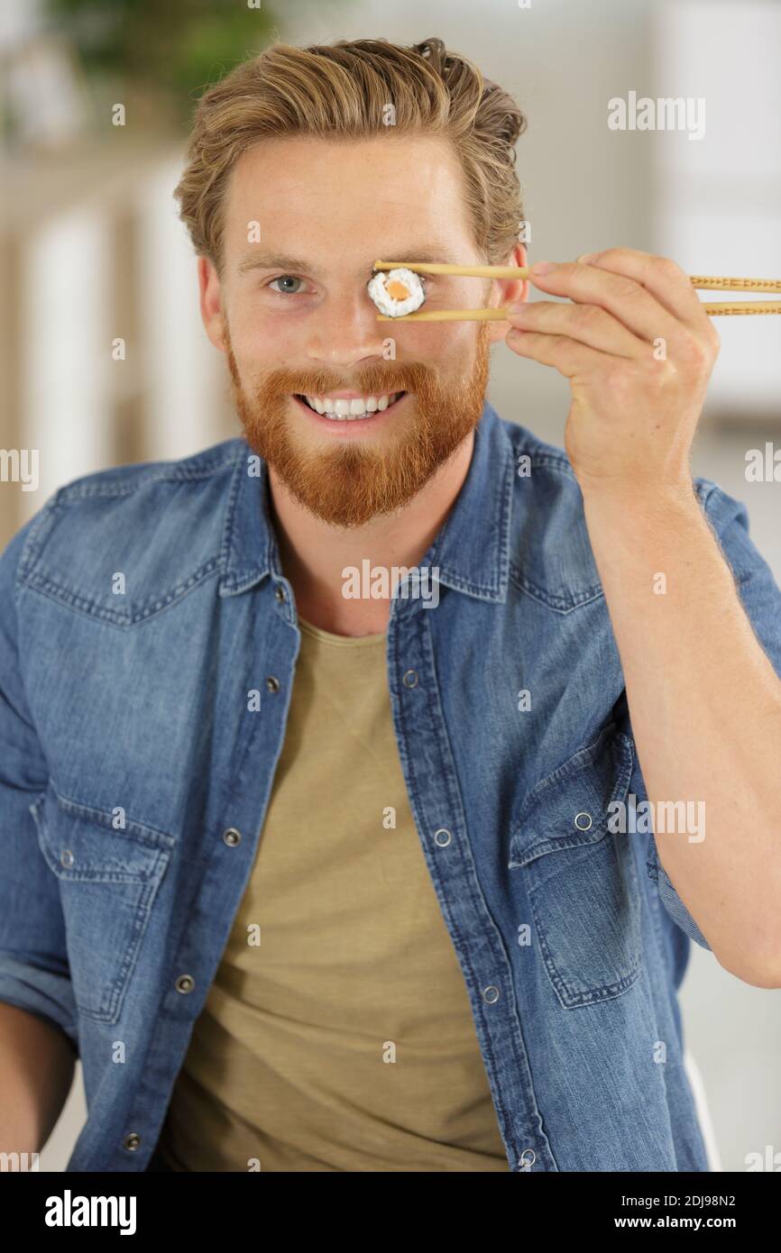 happy man with a sushi eye Stock Photo Alamy