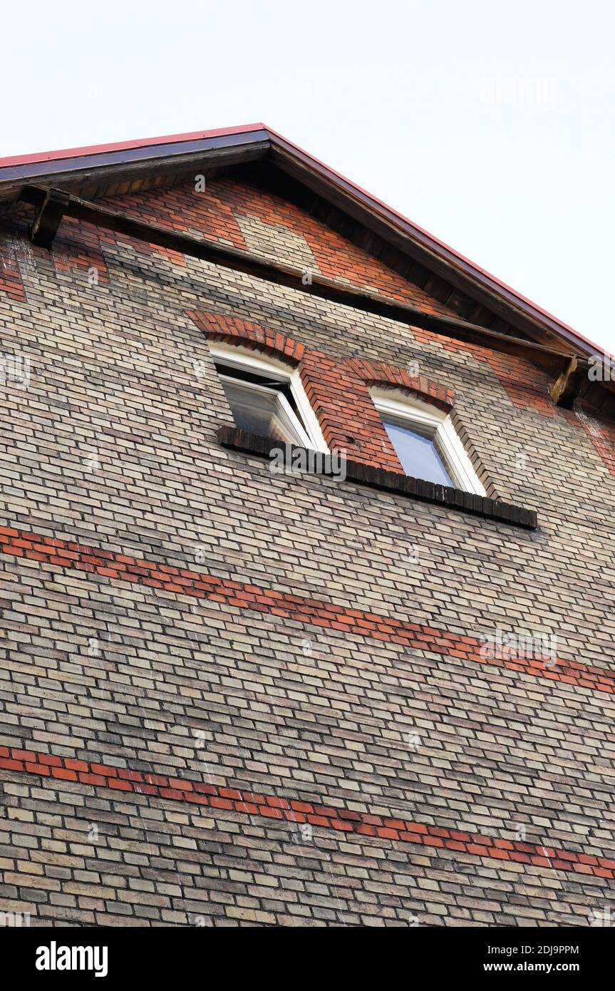 A vertical low angle shot of the facade of an old building Stock Photo ...