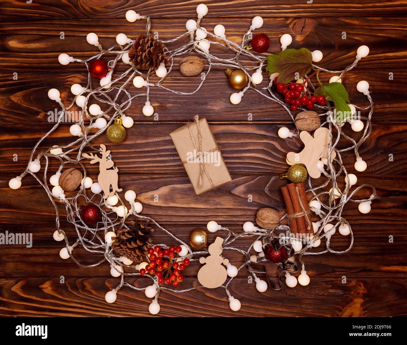 High angle view of Christmas present wrapped in craft paper. Stock Photo