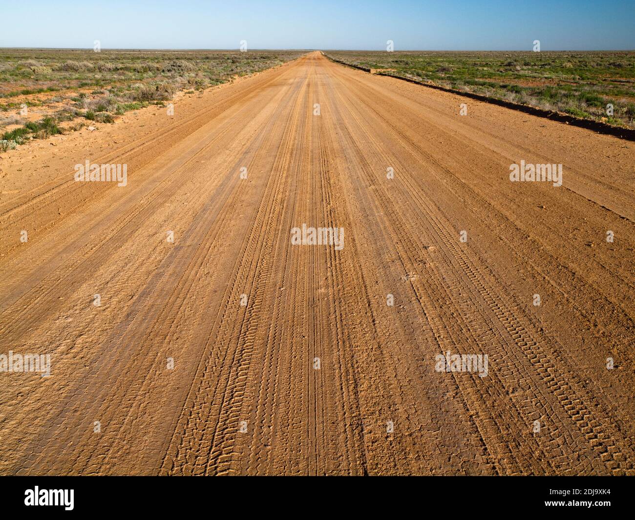 Tyre tracks along the unsealed William Creek Road cut through the desert towards Coober Pedy Tyre tracks along the unsealed William Creek Road cut through the desert towards Coober Pedy
