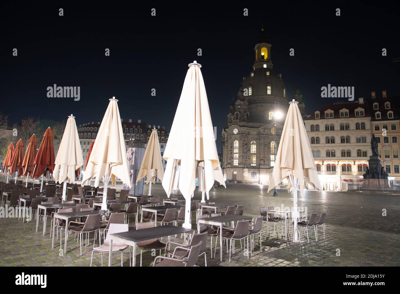 Dresden, Germany. 14th Dec, 2020. Empty tables and chairs stand on the Neumarkt in front of the Frauenkirche. Saxony will go into a hard lockdown from 14 December 2020. Public life will remain shut down until 10 January 2021. In addition to most shops, day-care centres, schools and after-school care centres are also closed. As in spring, emergency care is available for children of parents of systemically important professions. The Free State of Bavaria is considered a Corona focal point nationwide. Credit: Sebastian Kahnert/dpa-Zentralbild/dpa/Alamy Live News Stock Photo