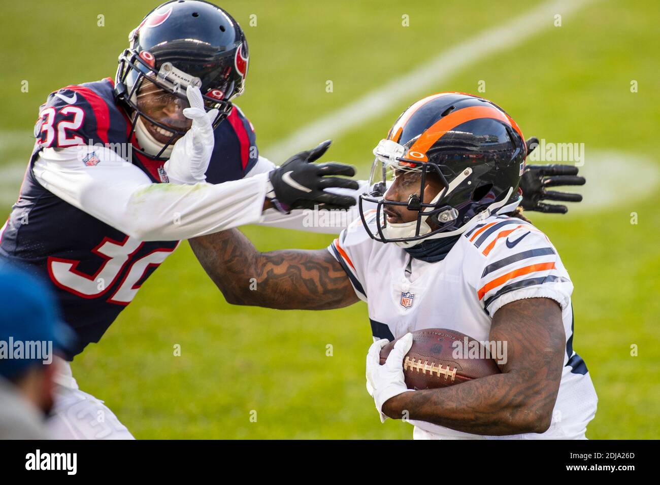 Chicago, Illinois, USA. 13th Dec, 2020. - Bears #84 Cordarrelle Patterson  stiff arms Texans #32 Lonnie Johnson Jr. during the NFL Game between the  Houston Texans and Chicago Bears at Soldier Field